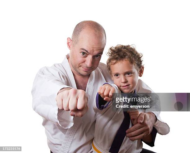 father and son karate - martial arts stock pictures, royalty-free photos & images