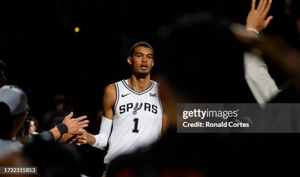 Victor Wembanyama of the San Antonio Spurs is introduced before the start of the first half against the Houston Rockets in a pre-season NBA game at...