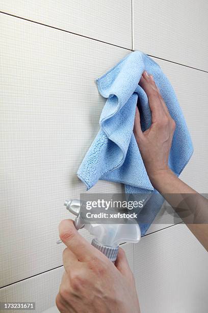 hands cleaving a white surface with a cloth and spray - microfiber stock pictures, royalty-free photos & images