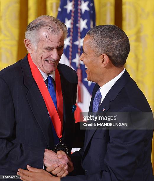 President Barack Obama presents the 2012 National Humanities Medal to sports writer Frank Deford during a ceremony in the East Room of the White...