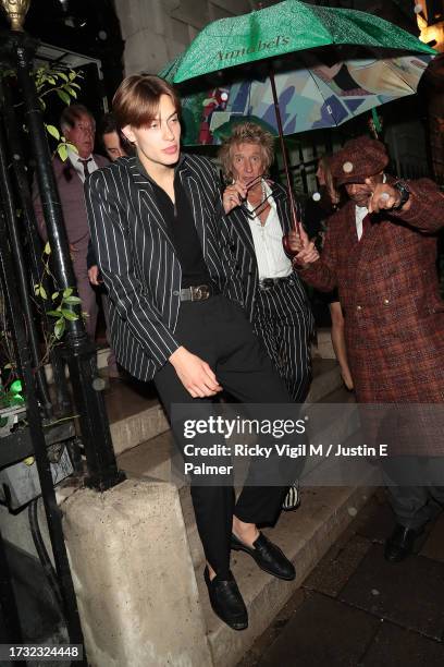 Alastair Wallace Stewart and Rod Stewart are seen leaving Annabel's on October 12, 2023 in London, England.