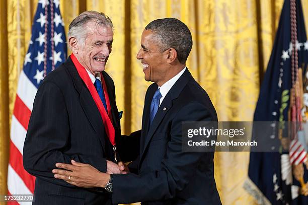 President Barack Obama presents a 2012 National Humanities Medal to National Humanities Medal to writer Frank Deford during a ceremony in the East...