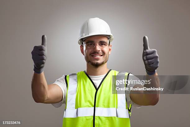 safety and protection at work. - white jumpsuit stock pictures, royalty-free photos & images