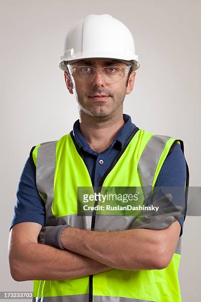 manual worker portrait wearing safety gear - helmet stock pictures, royalty-free photos & images