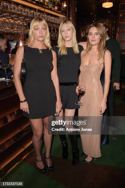 Alexia Mavroleon, Ella Richards and Camille Rowe attend Reformation's and Camille Rowe's dinner and cocktail party to celebrate their collaboration...