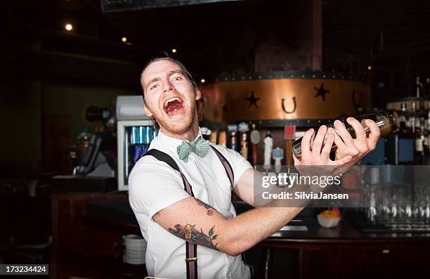 crazy bartender making cocktail - bartender stock pictures, royalty-free photos & images