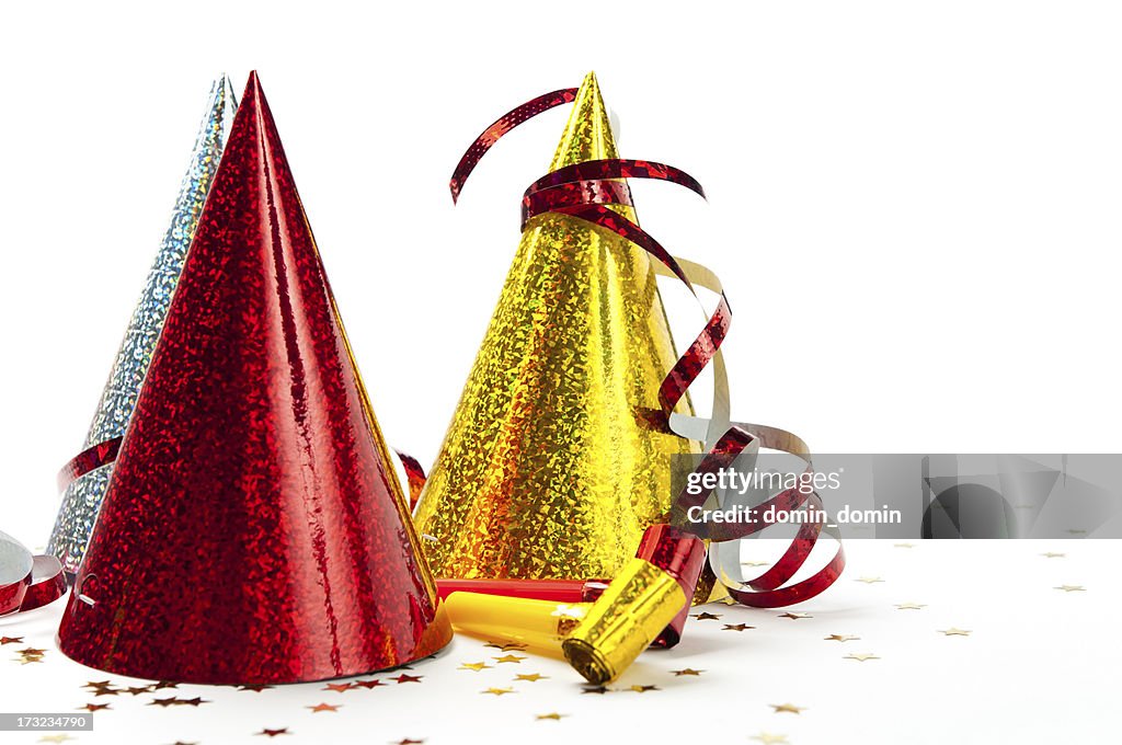 Party decorations: hats, whistles, streamers, confetti, isolated on white background