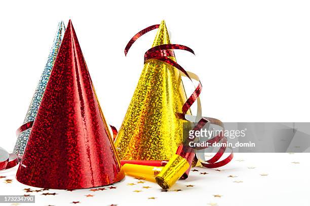 party decorations: hats, whistles, streamers, confetti, isolated on white background - gold streamer stock pictures, royalty-free photos & images