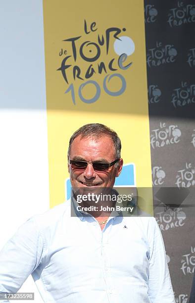 Bernard Hinault stands on the podium after Stage Eleven of the Tour de France 2013 - the 100th Tour de France -, a 33 km individual time trial from...