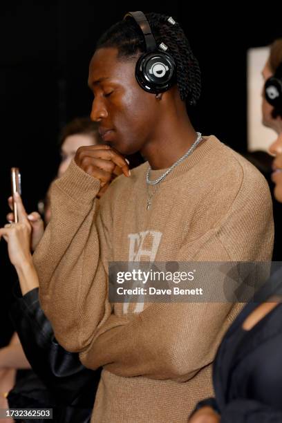 Guest attends Mr Eazi's "The Evil Genius" Art And Music Experience 1-54 London at Somerset House on October 12, 2023 in London, England.