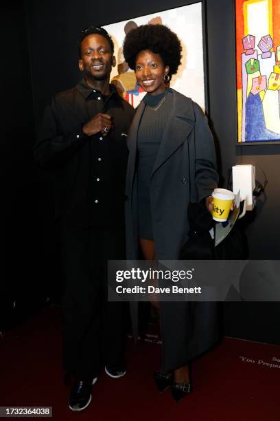 Mr Eazi and guest attend Mr Eazi's "The Evil Genius" Art And Music Experience 1-54 London at Somerset House on October 12, 2023 in London, England.