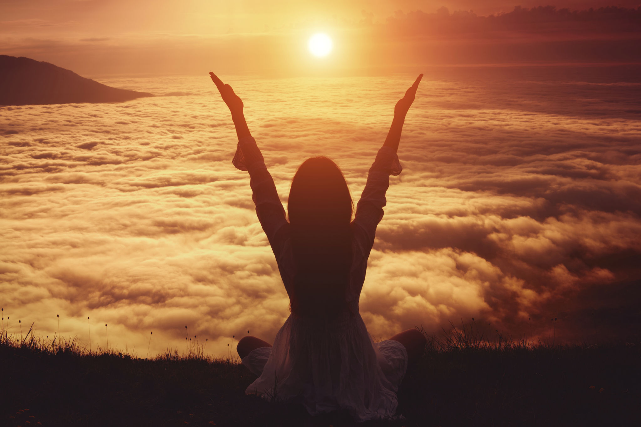 Woman lifting her arms in immense joy Woman lifting her arms in immense joy