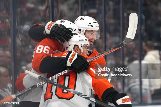 Sean Couturier of the Philadelphia Flyers, Joel Farabee of the Philadelphia Flyers and Bobby Brink of the Philadelphia Flyers celebrate a goal during...