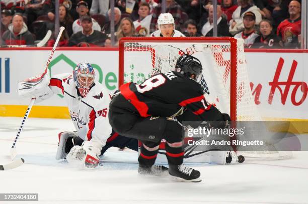 Darcy Kuemper of the Washington Capitals makes a save against Tim Stützle of the Ottawa Senators at Canadian Tire Centre on October 18, 2023 in...