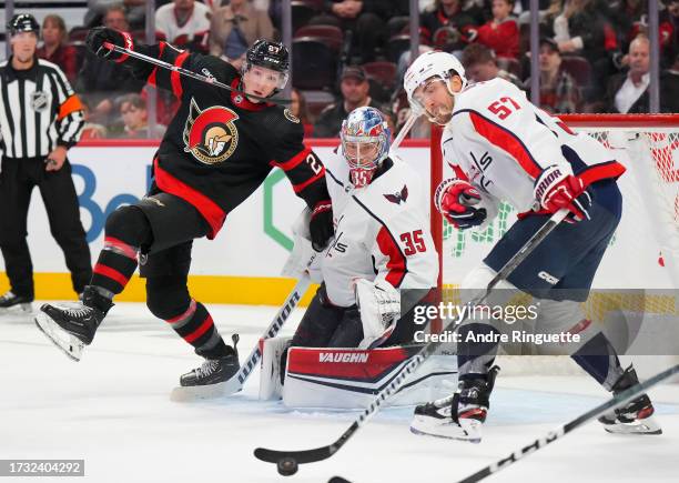 Parker Kelly of the Ottawa Senators loses his balance in front of Darcy Kuemper of the Washington Capitals at Canadian Tire Centre on October 18,...