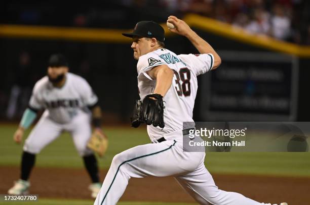 Paul Sewald of the Arizona Diamondbacks delivers a pitch against the Los Angeles Dodgers during Game Three of the Division Series at Chase Field on...