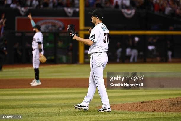 Paul Sewald of the Arizona Diamondbacks celebrates a win against the Los Angeles Dodgers during Game Three of the Division Series at Chase Field on...