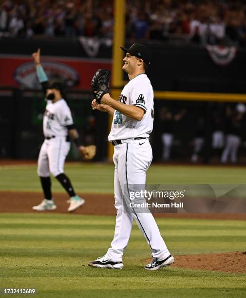 Paul Sewald of the Arizona Diamondbacks celebrates a win against the Los Angeles Dodgers during Game Three of the Division Series at Chase Field on...