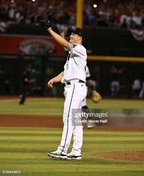 Paul Sewald of the Arizona Diamondbacks celebrates a win against the Los Angeles Dodgers during Game Three of the Division Series at Chase Field on...