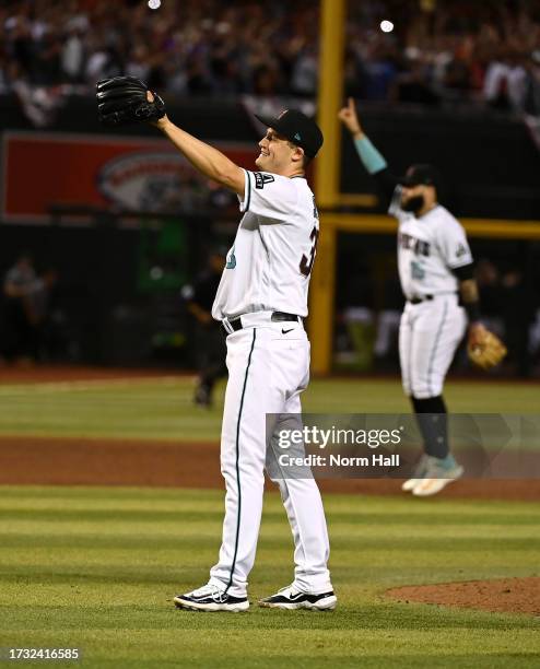 Paul Sewald of the Arizona Diamondbacks celebrates a win against the Los Angeles Dodgers during Game Three of the Division Series at Chase Field on...