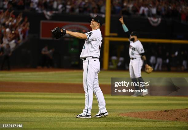 Paul Sewald of the Arizona Diamondbacks celebrates a win against the Los Angeles Dodgers during Game Three of the Division Series at Chase Field on...