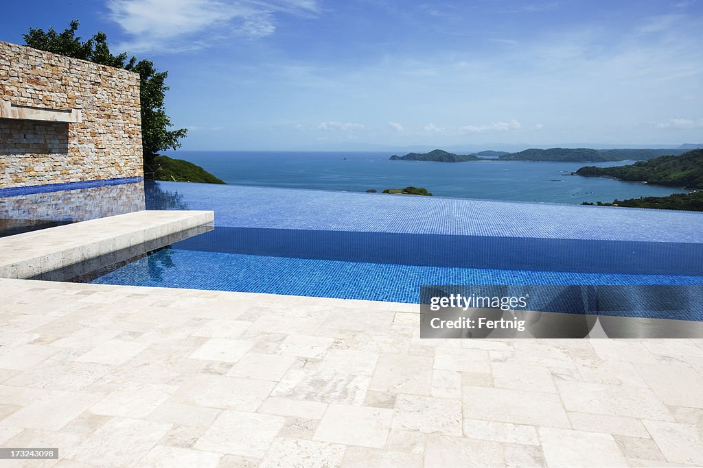 Pool Over View Patio And Infinity Pool Overlooking The Ocean High-Res Stock Photo ...