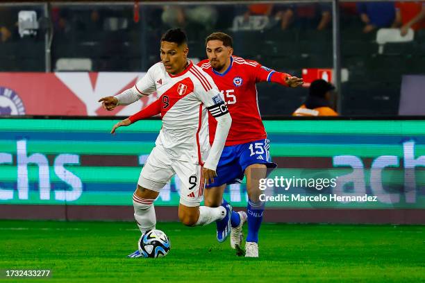 Paolo Guerrero of Peru battles for possession with Diego Valdes of Chile during the FIFA World Cup 2026 Qualifier match between Chile and Peru at...
