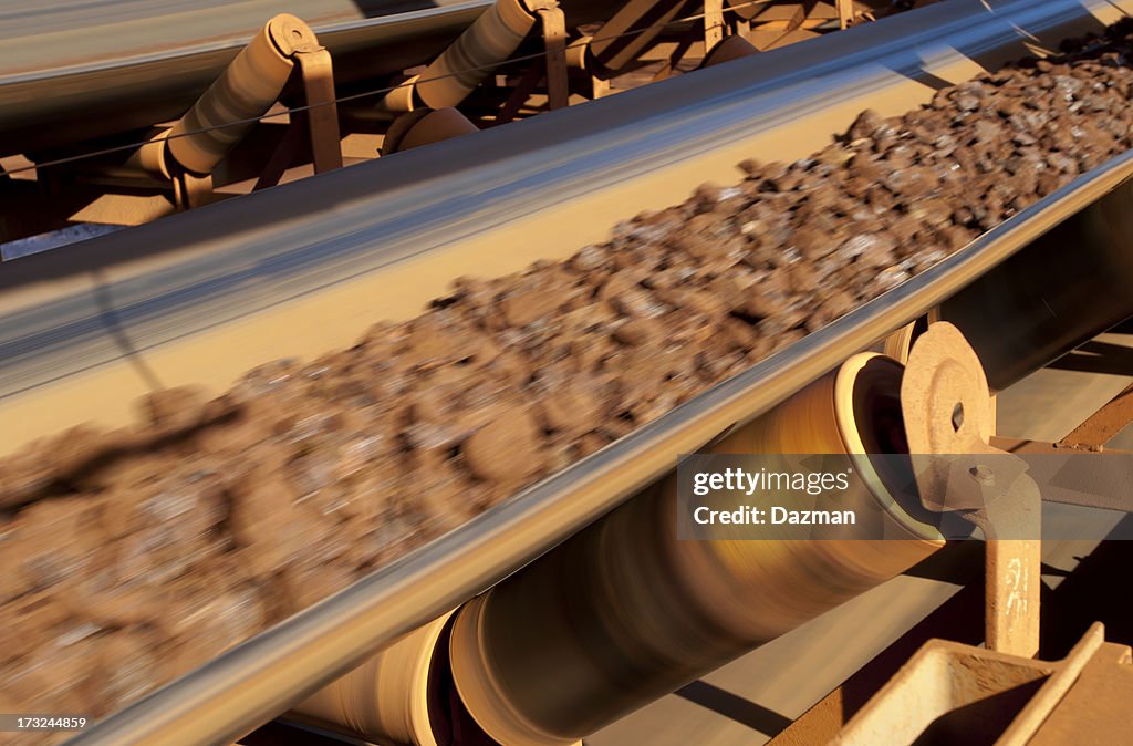 Conveyor belt carrying ore at a minesite.