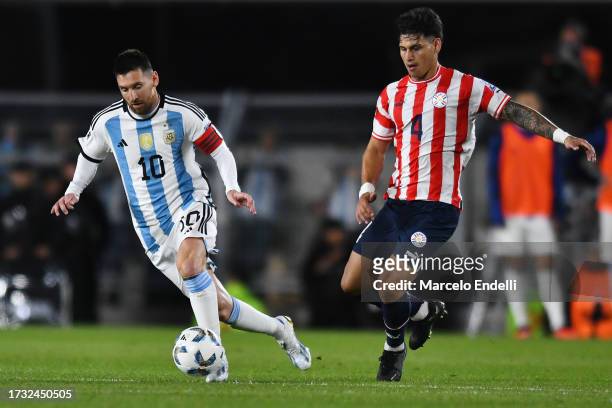 Lionel Messi of Argentina and Matias Espinoza of Paraguay compete for the ball during the FIFA World Cup 2026 Qualifier match between Argentina and...