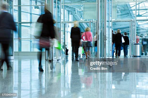 blurred people in corridor - shop entrance stock pictures, royalty-free photos & images