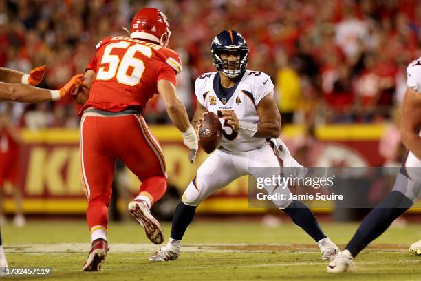 Russell Wilson of the Denver Broncos looks to pass against the Kansas City Chiefs during the first quarter at GEHA Field at Arrowhead Stadium on...