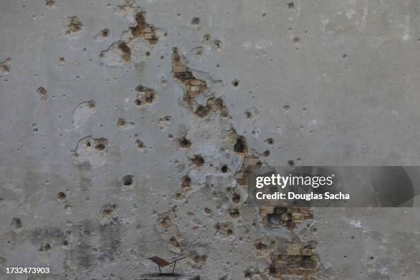 explosion and shrapnel damage at a war zone - bullet holes stock pictures, royalty-free photos & images