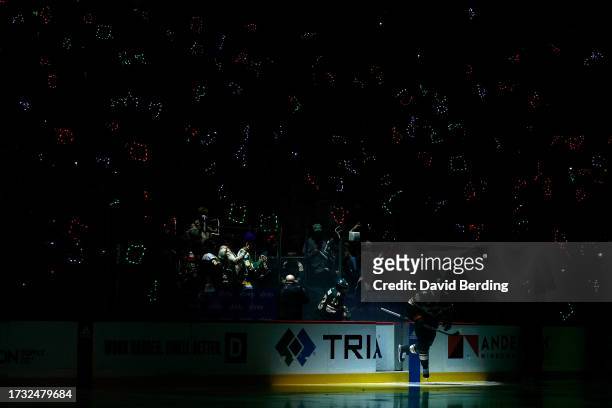 Marcus Johansson and Alex Goligoski of the Minnesota Wild skates onto the ice prior to the start of the game against the Florida Panthers during the...