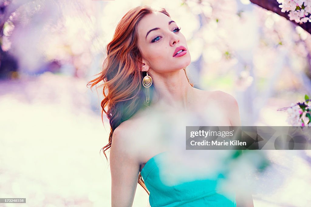 Woman surrounded by white flowers