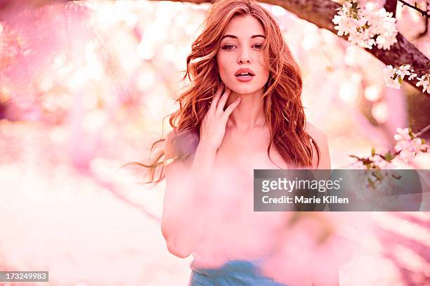 beautiful woman surrounded by pink flowers - pink dress stock pictures, royalty-free photos & images