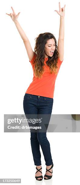 happy young woman with arms up - rock object stockfoto's en -beelden