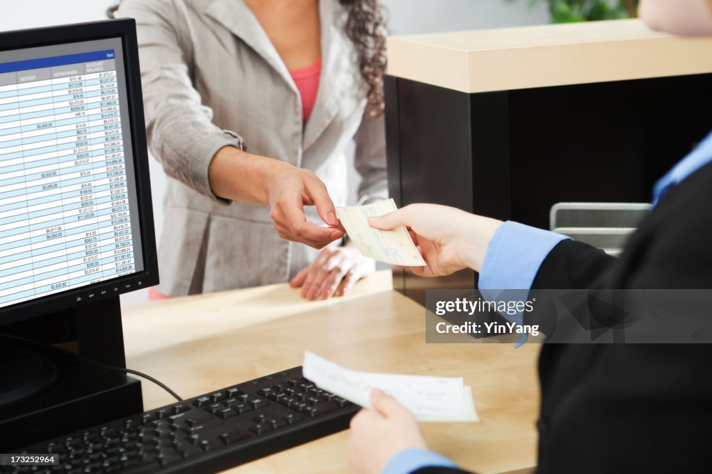 Bank Teller Service with Customer Deposit Transaction Over Business Counter