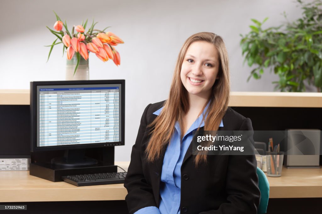 Woman Bank Teller at Retail Banking Counter Providing Financial Service