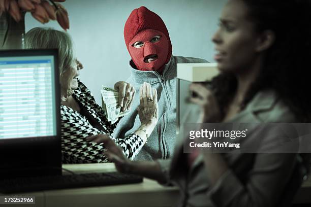 robber with teller and customer in retail bank window - bank counter old stockfoto's en -beelden