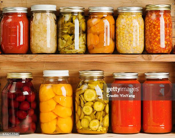 home canning of summer vegetables on wooden shelves hz - canning stock pictures, royalty-free photos & images