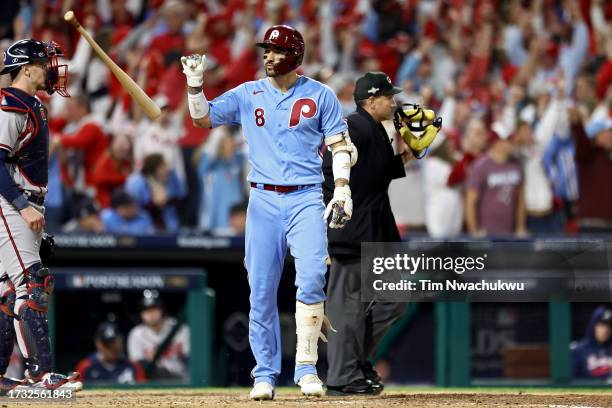 Nick Castellanos of the Philadelphia Phillies tosses his bat after hitting a home run in the sixth inning against the Atlanta Braves during Game Four...