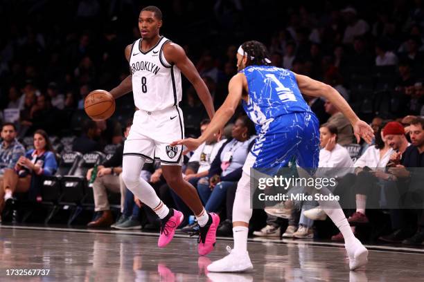 Lonnie Walker IV of the Brooklyn Nets drives to the net against Jason Siggers of Maccabi Ra'anana during an exhibition game at Barclays Center on...