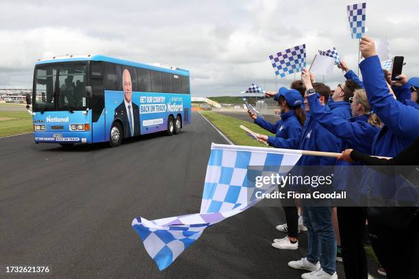 National Party leader Christoper Luxon on his campaign bus as it does laps of the raceway at Hamptons Downs Motorsport Park on October 13, 2023 in...