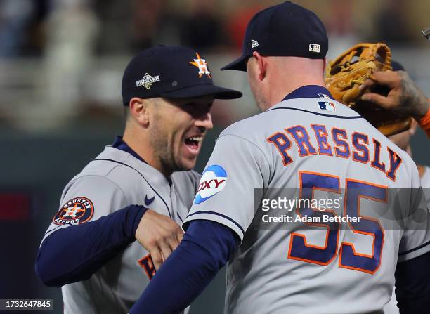 Alex Bregman of the Houston Astros wears a hat with the Israeli Star of David on it at the end of the game against the Minnesota Twins during Game...