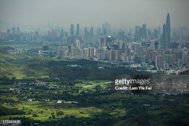 General view of North East New Territories in front of the Shenzhen skyline taken from Ping Che village on July 11, 2013 in Hong Kong, China. The...