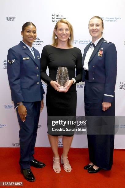 Natalie Schneider poses with U.S. Air Force members dur Women's Sports Foundation's Annual Salute To Women In Sports at Cipriani Wall Street on...