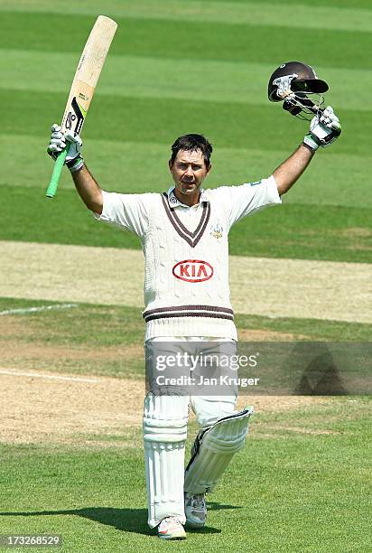 Ricky Ponting of Surrey celebrates and acknowledges the crowd as he reaches his century during the LV County Championship match between Surrey and...