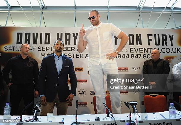 British heavyweight boxers Tyson Fury and David Haye attend a press conference to announce their upcoming title fight, on July 11, 2013 in London,...