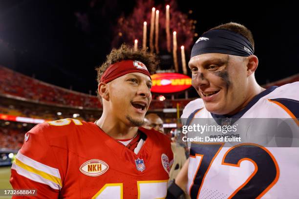 Patrick Mahomes of the Kansas City Chiefs and Garett Bolles of the Denver Broncos greet one another after the game at GEHA Field at Arrowhead Stadium...