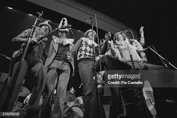 1st DECEMBER: English pop, poetry and comedy group Grimms perform live on stage at Kingston Polytechnic in Surrey, England in December 1973. Neil...